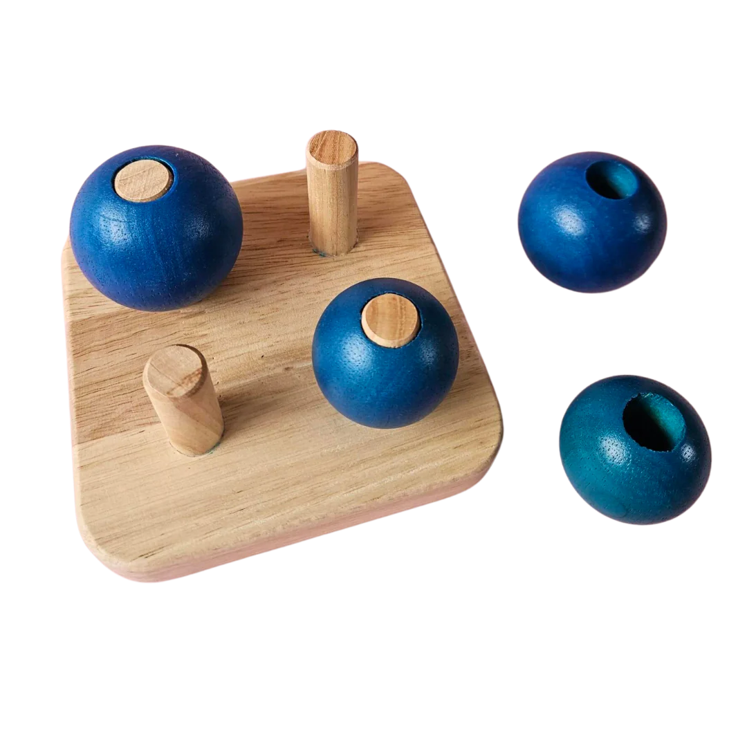 Four Blue Balls On
Small Pegs