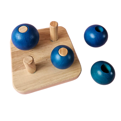Four Blue Balls On
Small Pegs